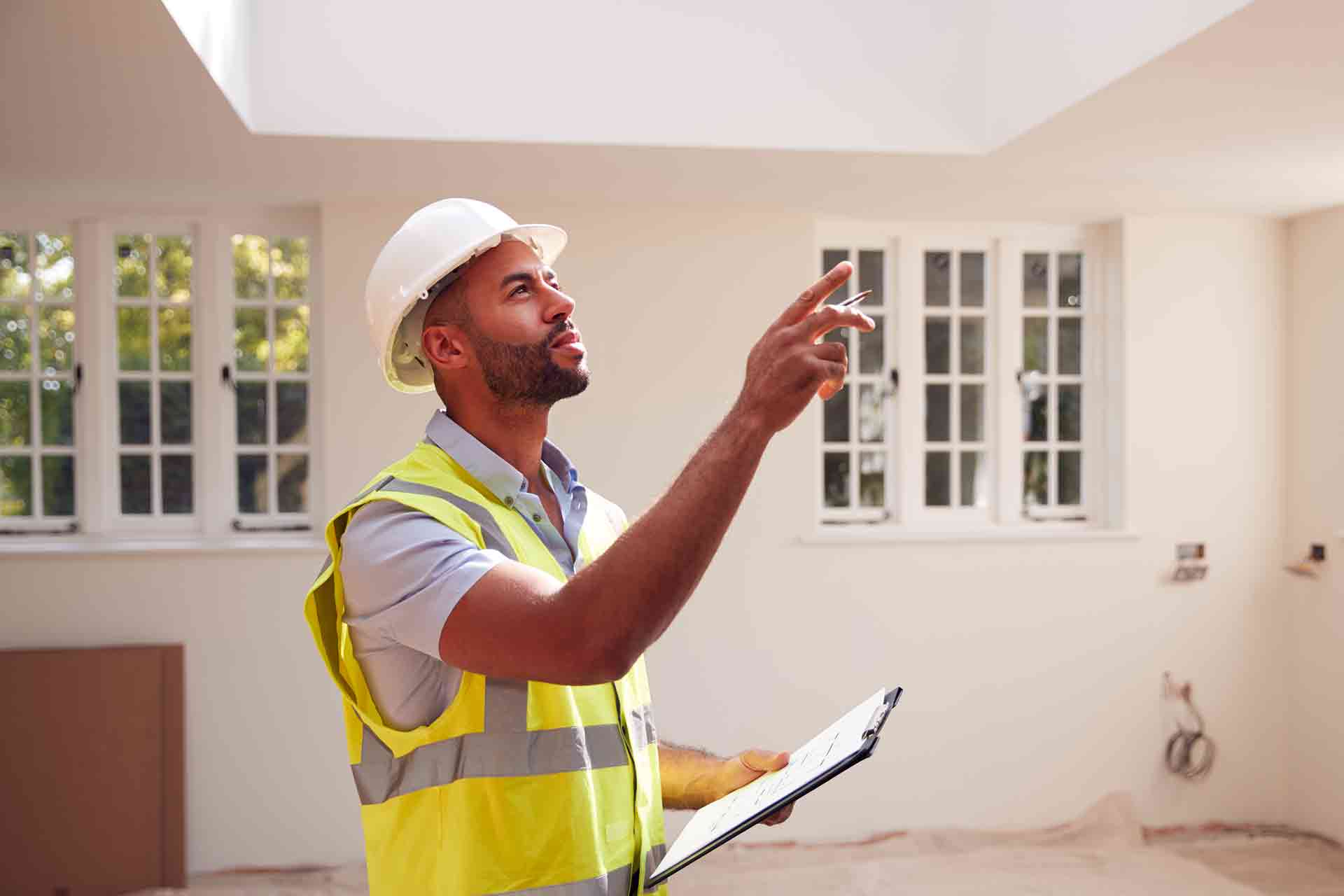 Third Party Wall Surveyors Blackburn reviewing plans between two parties during a dispute